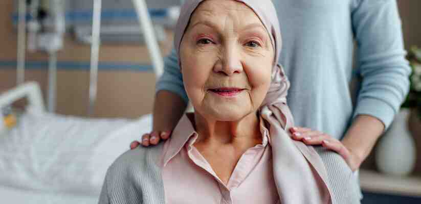 a hospital patient with a scarf on her head